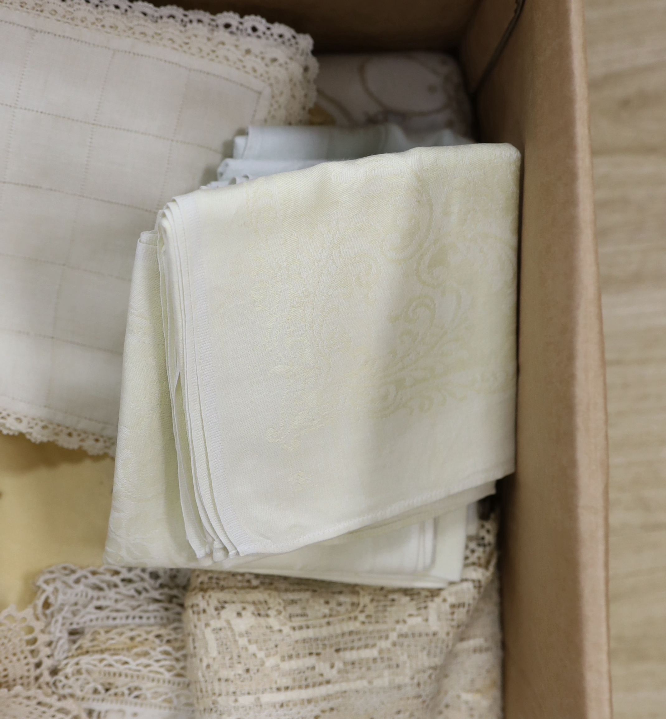 A collection of coloured embroidered linens